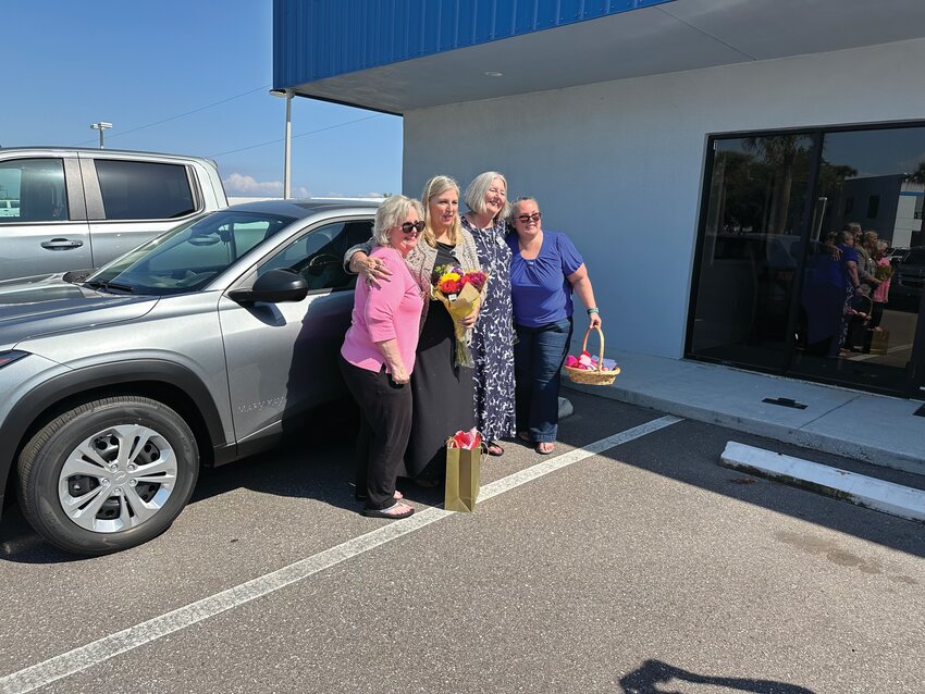 Pictured with family and friends, Janice Pietro is pictured with her new Chevy Trax, courtesy of Mary Kay..[Photo courtesy Janice Pietro]
