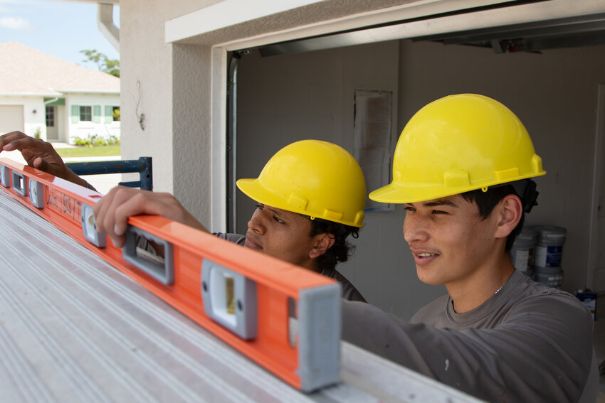 Immokalee Foundation Engineering & Construction Management students work onsite at the Learning Lab, the Immokalee Foundation's 18-home subdivision being built in Immokalee
