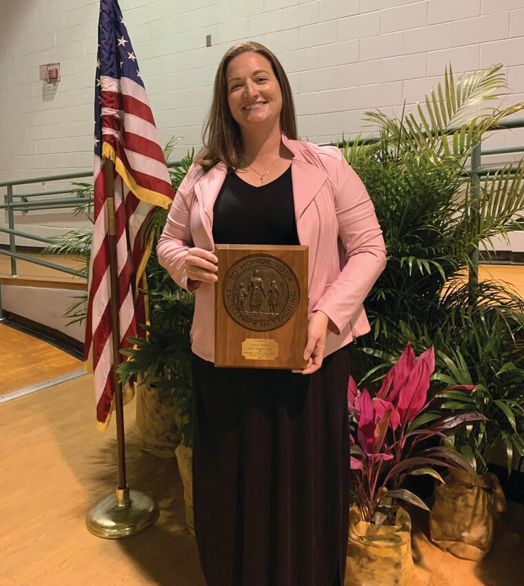 Christina Norman with her District Assitant Principal of the Year award in 2022. (Photo courtesy of Okeechobee Schools/Lake Okeechobee News)