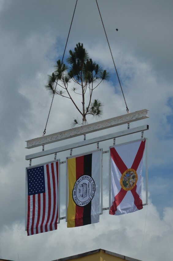 The Senminole Brighton Bay Hotel and Casino Topping Out ceremony was held on June 26. The final beam was signed by those present before it was lifted into place. The tree on top is a tradition attributed to the Scandinavian ritual of placing a tree on the top of a newly completed building. [Photo by Katrina Elsken/Lake Okeechobee News]