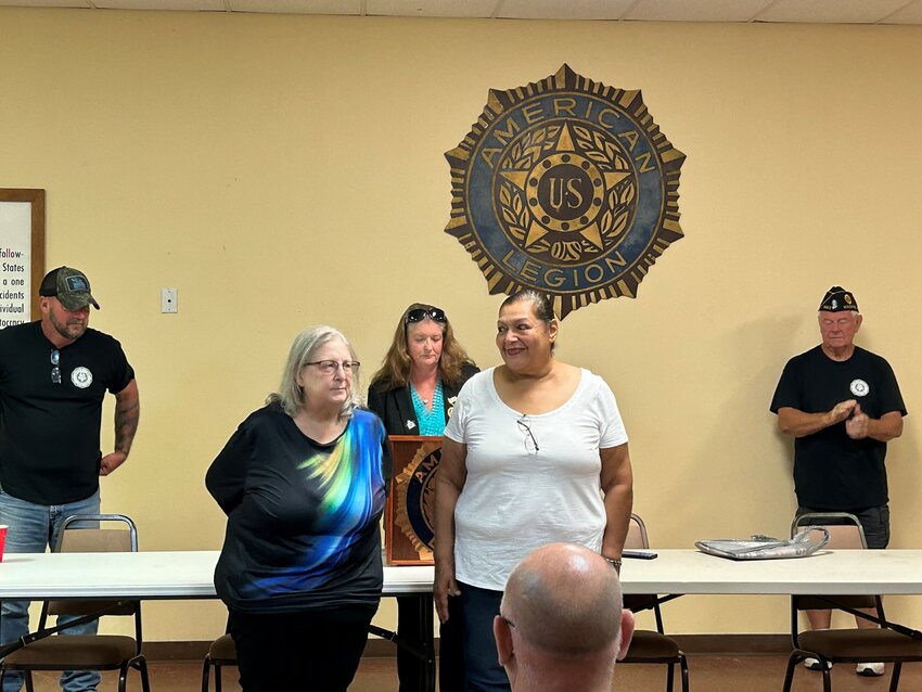 American Legion Auxiliary swears in President Julie Rivera (right) and secretary Georgia Goudy (left) on July 1.