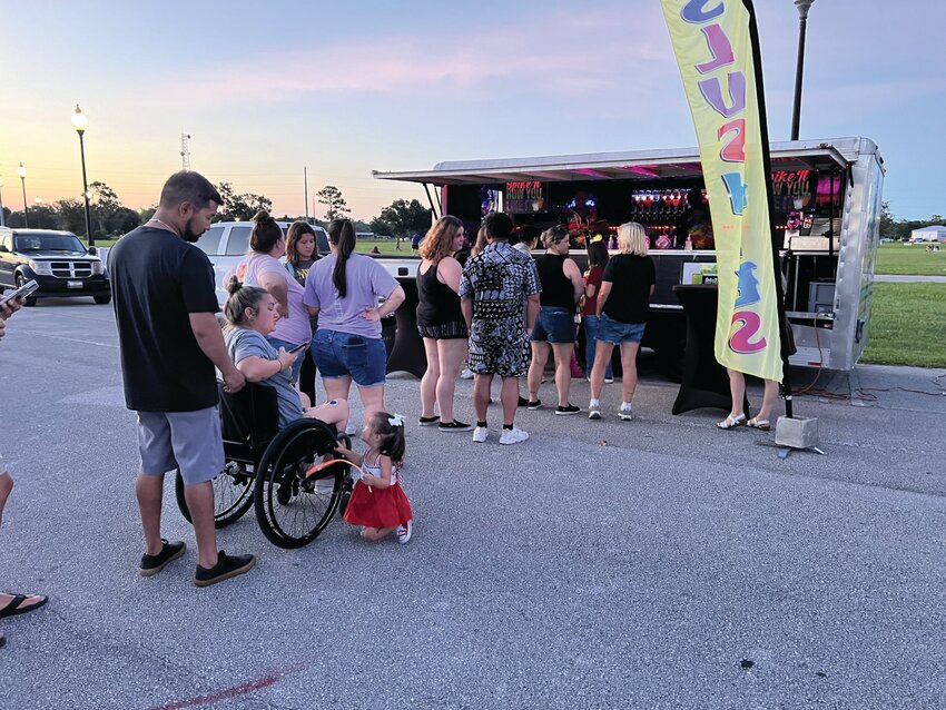 OKEECHOBEE -- Food trucks stayed busy at the community fireworks show at the Okeechobee Agri-Civic Center on July 6. [Photo by Katrina Elsken/Lake Okeechobee News]