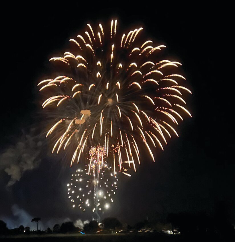 OKEECHOBEE -- Fireworks lit up the night sky above the Okeechobee Agir-Civic Center on July 6. [Photo by Katrina Elsken/Lake Okeechobee News]