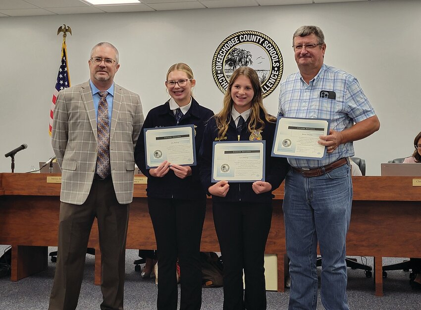 OKEECHOBBEE — OMS FFA students Lila and Lexi Bishop were Division 2 Overall Champions at the State Agriscience Fair. From left to right are Superintendent Dylan Tedders, Lila Bishop, Lexi Bishop and their advisor Brian Tremble.