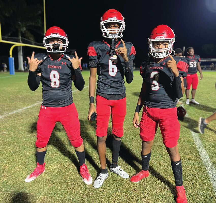 Epifanio Hernandez, Steaver Moore, and Aldrich Meyer pose for a pictures following their 33-0 win over Canterbury. [Photo courtesy LHS Athletics]