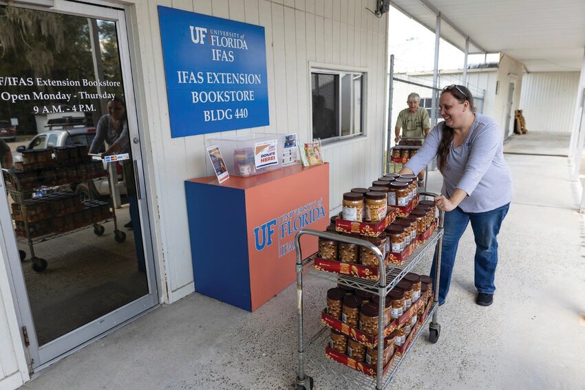 UF/IFAS employees collect donations made during the 2023 Peanut Butter Challenge.