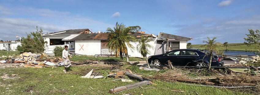 LAKEPORT -- This home on the Rim Canal was a two-story house before a tornado ripped the top story off on Oct. 9. [Photo by Katrina Elsken/Lake Okeechobee News]