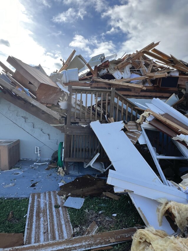 LAKEPORT -- A toilet is top of the wreckage of a Lakeport home hit by a tornado on Oct. 9, calling question to wisdom of seeking shelter in a bathroom during a tornado. [Photo by Katrina Elsken/Lake Okeechobee News]