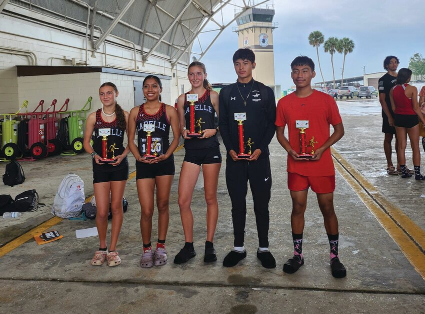 LHS had six runners finish in the top three in their races.  Laeda Lewis, Madison Zander, Natalia Salgado, Juan Morado, and Oscar Hernandez. [Photo courtesy Julio Ramirez]