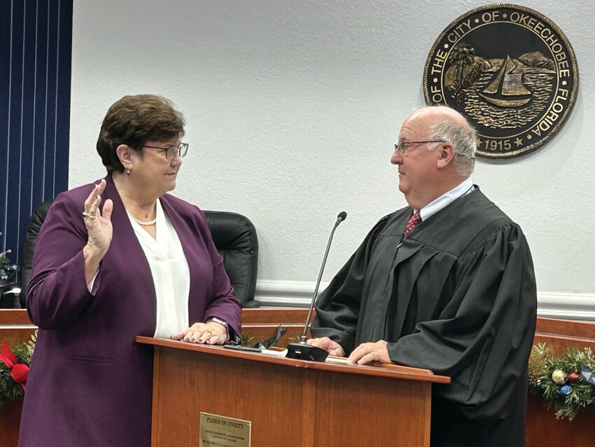 Council member Monica Clark was sworn in for her third term as a city council member by Judge William Wallace on Tuesday morning, Dec. 31. Clark served as vice mayor during her last term and said her goal is to serve her city as well as her father served the city of Belle Glade during his life time..[Photo by Cathy Womble/Lake Okeechobee News]