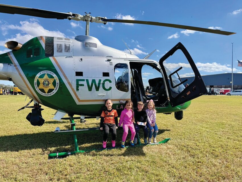 Local kids got a chance to see a FWC helicopter at the Okeechobee Agri-Civic Center during the Touch a Truck event. [Photo courtesy OCEDC]