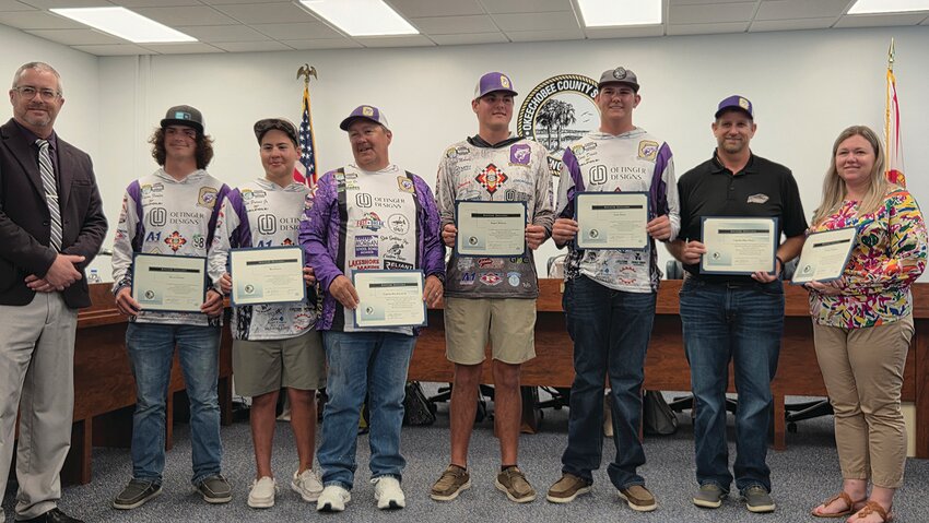 OKEECHOBEE — From left to right are Superintendent Dylan Tedders, Mason Fender, Ben Purvis, Captain Ben Purvis Sr., Ragyn Mohney, Lane Davis, Captain Matt Davis, and Coach Christen Coleman.