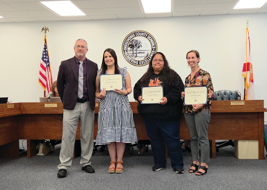OKEECHOBEE — Teachers nominated for five years with Okeechobee County Schools with Superintendent Dylan Tedders (right).