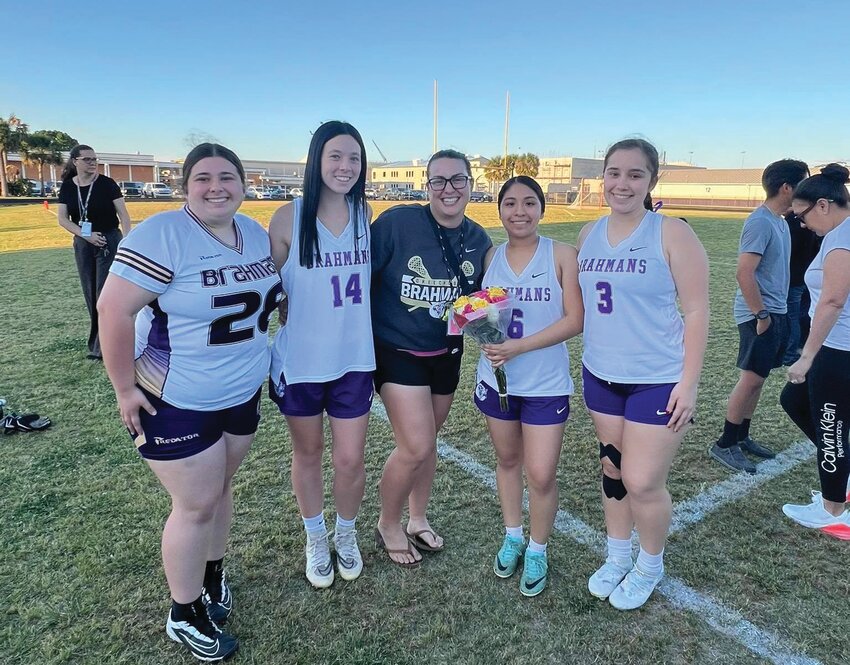 From left to right: Rachel Wilson, Shelby Busbin, Coach Aimee Kelly, Mayte Orta Santos, and  Malia Garces. [Photo courtesy OHS Girls Lacrosse]