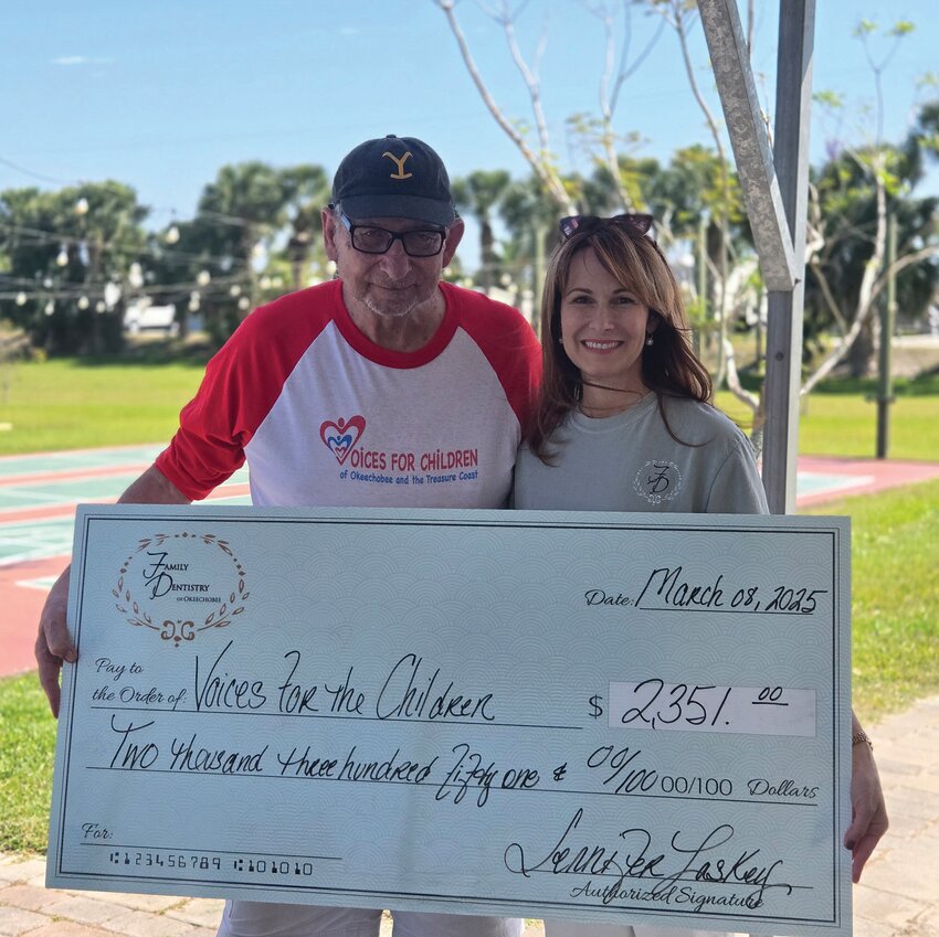 OKEECHOBEE –– Jennifer Laskey of Family Dentistry of Okeechobee presented a $2,351 check to a representative of Voices for the Children at their annual Pckleball Tournament at the Starlite RV Park and Resort on March 8.. [Photo courtesy Family Dentistry of Okeechobee]