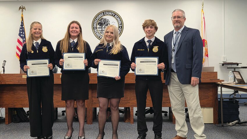 OKEECHOBEE — From left to right are OHS FFA Dairy Judging Team Ruby Keith, Lillie Bandi, Kathryn MontesDeOca, and Joshua Larson with Superintendent Dylan Tedders.