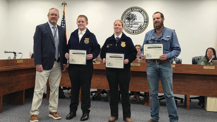 OKEECHOBEE — From left to right are Superintendent Dylan Tedders with OHS FFA Poultry Team members Andrew Roehm, Sarah Phillips and Coach Jared Prescott.
