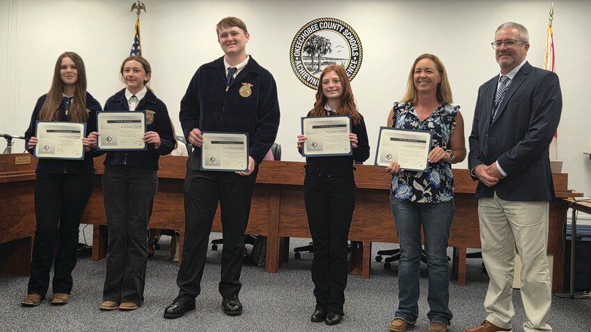 OKEECHOBEE — From left to right are YMS FFA Poultry Team members Autumn Sparkman, Brecken Smith, Raymond Massey, Delaney Raney, Coach/Advisor Christal Lewis with Superintendent Dylan Tedders.