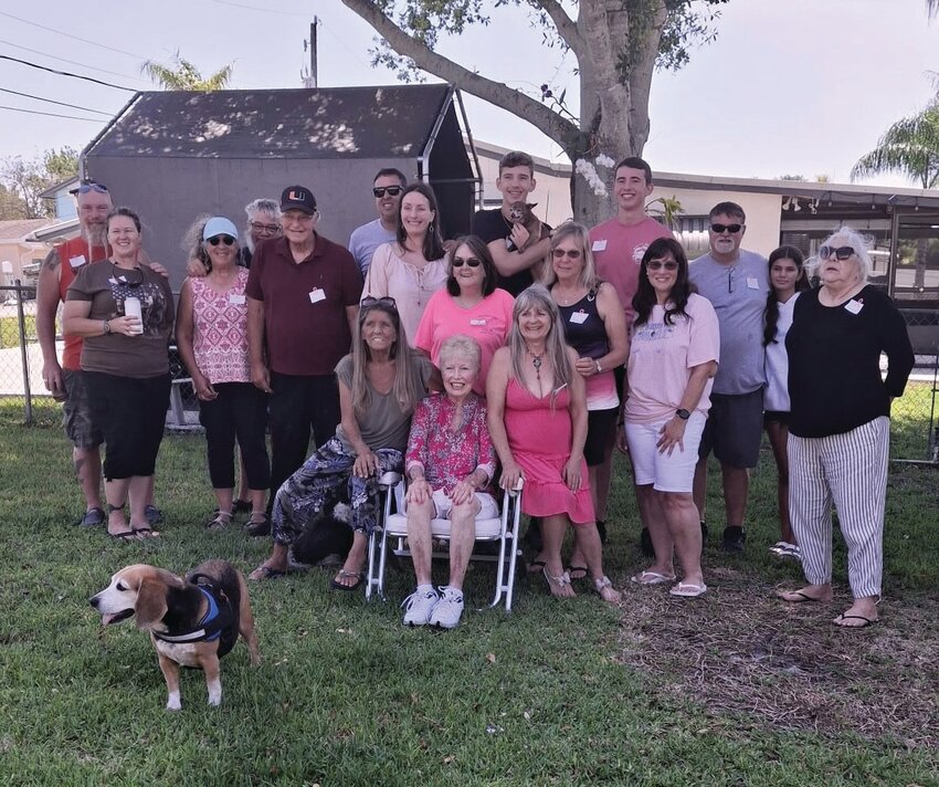Pictured are Joyce McHargue , Karen Noel , Gwyn Lackey , Mary Lou Gillette , Janie & Greg Sullivan , Anna &Keith Canady,  Enrique & Heather ,& Eric & Papo   Bassas , Sharon & Gordon Bowne , Deb & Jim Westphal. Friends gathered Saturday for a party commemorating the shaving of their friend Sandy thomas' head during her battle with breast cancer..[Photo by Karen Noel]