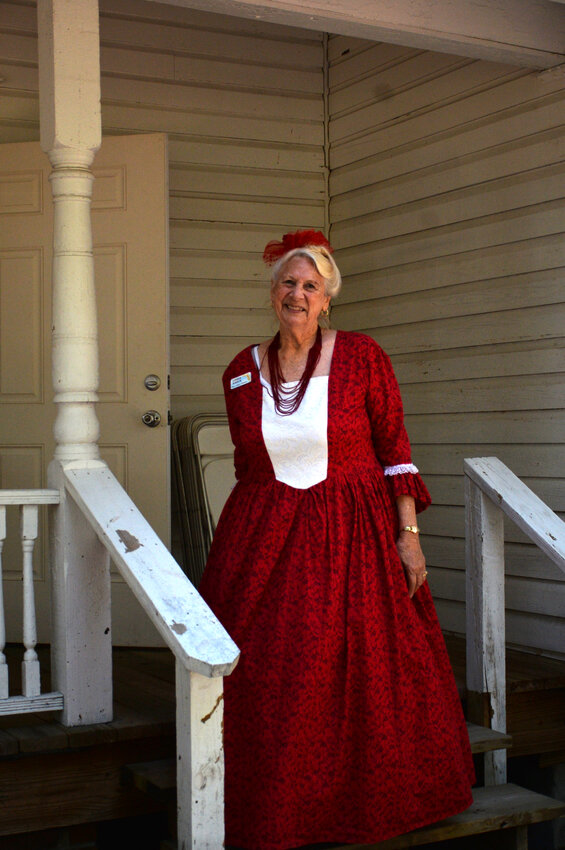 Lonnie Kirsch stands on the steps of the old school house at the Edna Pearce Lockett Estate during the 2025 Heritage Festival. [Photo by Katrina Elsken/Lake Okeechobee News]