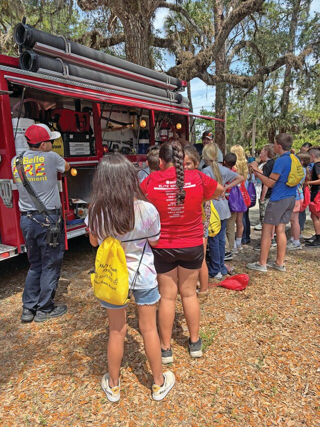 Students learned firsthand about  fire safety and how  emergency and law enforcement agencies work together for the benefit of our community. [Photo courtesy Margaret England]