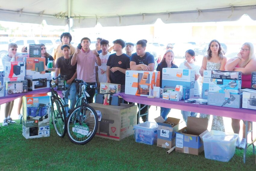 This photo was taken at a prior Grad Party. Gifts are given out to OHS graduates at the Grad Party are purchased using donations from community members, organizations, and Children’s Services Council. [Courtesy photo]