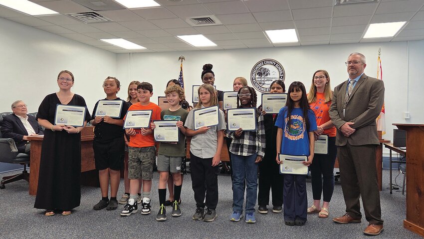 OKEECHOBEE — The Everglades Elementary School Science Olympiad Team with their coaches and Superintendent Dylan Tedders (right).