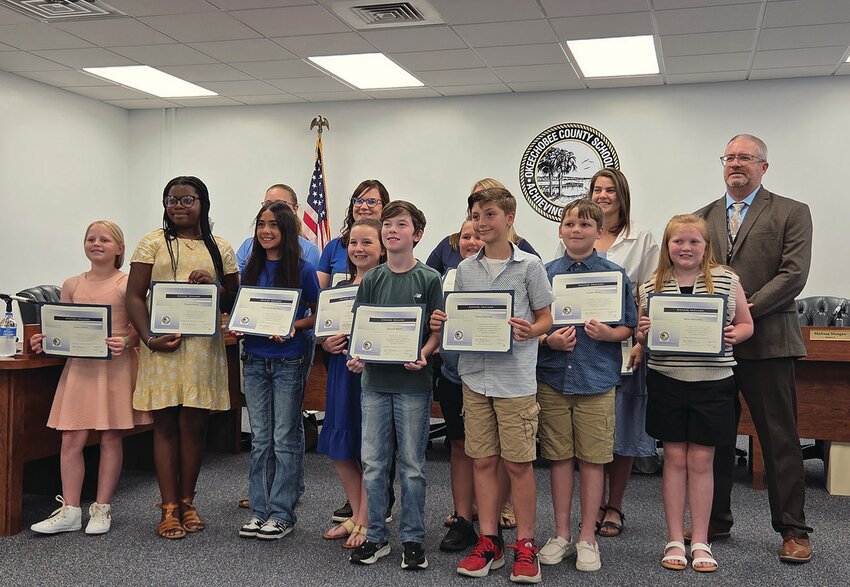 OKEECHOBEE — The South Elementary School Science Olympiad Team with their coaches and Superintendent Dylan Tedders (right).