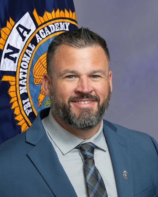 OCSO Lt. Heath Hughes graduates from FBI training academy.