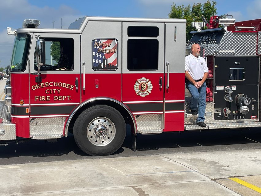 Former Fire Chief Herb Smith is pictured with a city fire truck. The city fire department was closed in June of 2021.
