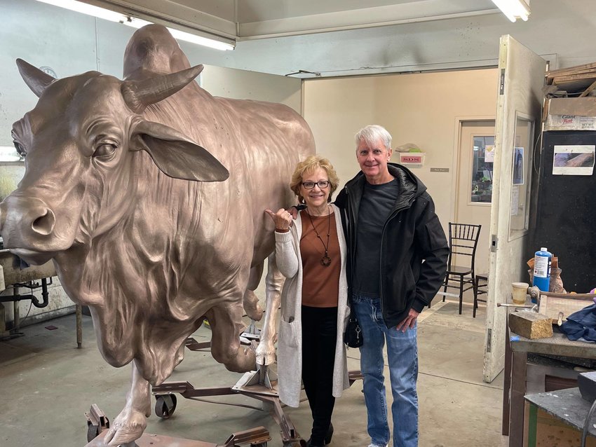Bridgette McElwee Waldau of Okeechobee Main Street visited Salt Lake City, Utah at the Alpine Art Center where she witnessed all aspect of the Cattle Drive Sculpture process and even got to help place the patina on the Brahma Bull. She is pictured with artist J. Michael Wilson.