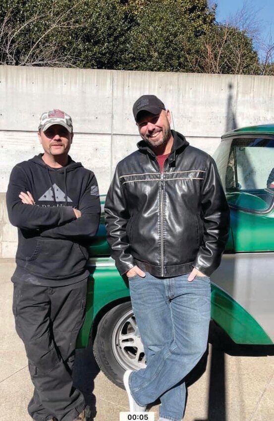 Robert Buster (right) is pictured with country singer John Rich.