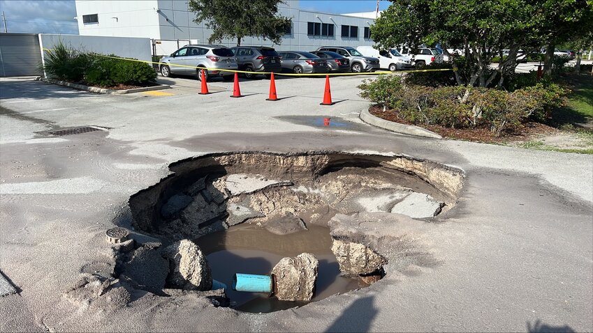 OKEECHOBEE Emergency Operations Center employees in Okeechobee County were startled to find a huge sink hole in the middle of their driveway this weekend. The cause is believed to be from a water pipe bursting. Okeechobee Utility Authority is investigating.