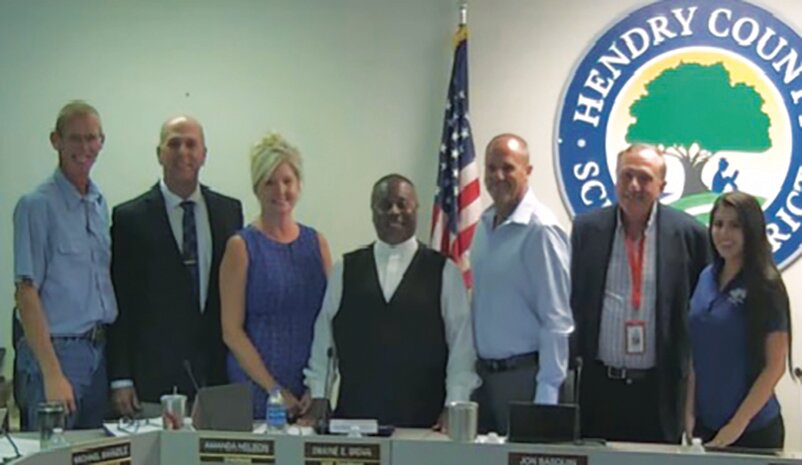 Heartland Homes of Florida was recognized by the Hendry County School Board Aug. 15 for its 2nd Annual Shoes &amp; Socks event. L-R: Heartland Homes Kevin Berth, Superintendent of Schools Michael Swindle, Board Chairwoman Amanda Nelson, Vice Chair Dwayne Brown, Board Members Jon Basquin and Paul Samerdyke and Heartland Homes Jessica Molina.