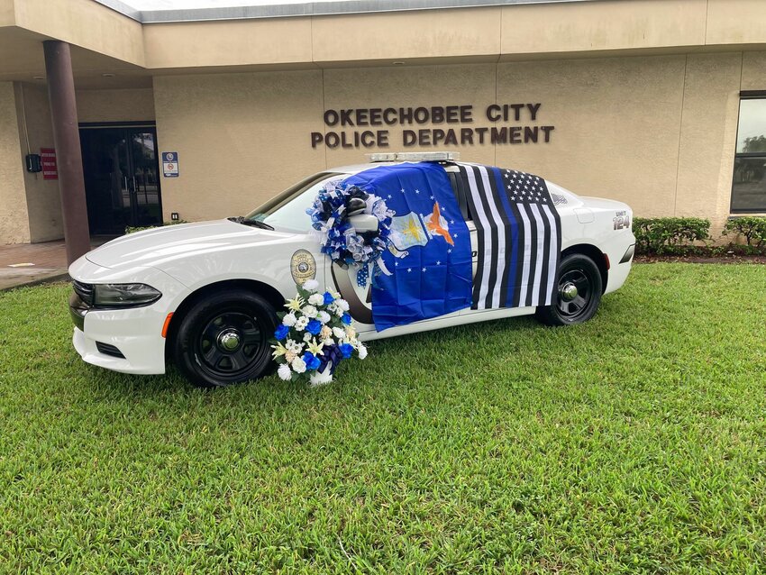 If the community would like to pay their respects, a memorial has been placed in front of the Okeechobee Police Department.