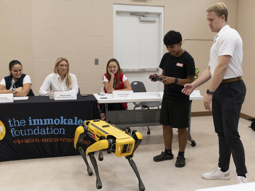 A student experiences the abilities of Spot, the Robot Dog during the &ldquo;Business, Construction and Engineering Career Pathway&rdquo; event presented by the&nbsp;Immokalee Foundation on Dec. 7.