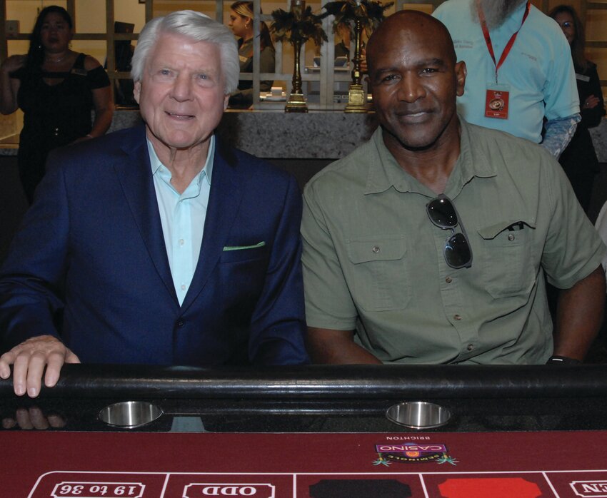 Football coach Jimmy Johnson was joined by boxing legend Evander Holyfield for the first roll and first spin ceremony at the Brighton casino.