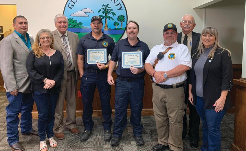 MOORE HAVEN -- At the Glades County Commission meeting on Feb. 12, two Glades County employees, Firefighter/EMT Hunter Mehrer, and Firefighter/EMT Hilario Rodriguez, were presented with a Valor Pin and Certificate of Valor for their services performed on Dec. 29, 2023.. From Left to Right: Commissioner Tony Whidden, Public Safety Director Angela Snow-Colegrove, Commission Chairman Tim Stanley, Firefighter/EMT Rodriguez, Firefighter/EMT Mehrer, Public Safety Chief of Operations Lawrence Factor, Commissioner Jerry Sapp, and Commissioner Hattie Taylor. [Photo courtesy Glades County Government]