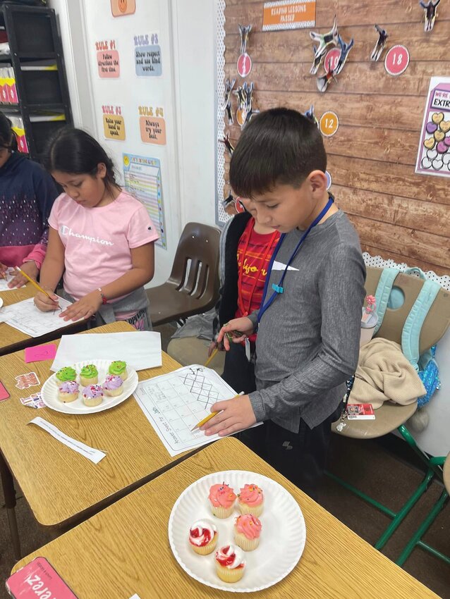 LABELLE -- Third graders in Amber Barnett's class at Country Oaks Elementary School used holiday treats to learn about fractions on Valentine's Day. [Photo courtesy Country Oaks Elementary School]