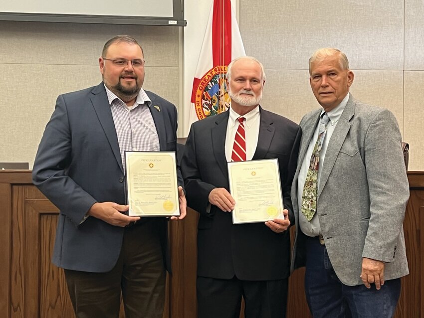 OKEECHOBEE &ndash; The Okeechobee County Board of Commissioners designated Feb. 18-24 as Engineers Week. Left to right are Marcos Montes De Oca, Stef Mathes and Okeechobee County Commission Chair David Hazellief. Founded by NSPE in 1951, Engineers Week is dedicated to ensuring a diverse and well educated future engineering workforce by increasing understanding of and interest in engineering and technology careers. Today, Engineers Week is a formal coalition of more than 70 engineering, education, and cultural societies, and more than 50 corporations and government agencies. Dedicated to raising public awareness of engineers' positive contributions to quality of life, Engineers Week promotes recognition among parents, teachers, and students of the importance of a technical education and a high level of math, science, and technology literacy, and motivates youth, to pursue engineering careers in order to provide a diverse and vigorous engineering workforce. [Photo by Katrina Elsken/Lake Okeechobee News]