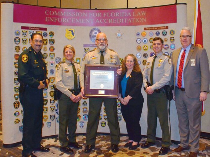 The FWC Division of Law Enforcement received their Excelsior Recognition plaque at the Feb. 19-23, Florida Police Accreditation Conference. Pictured left to right: Sheriff Billy Woods of Marion County, Capt. Dana Russell, Col. Brian Smith, Accreditation Manager Elizabeth Kamerick, Lt. Richard Doricchi and Stacy Lehman, Executive Director of the Florida Accreditation Office.