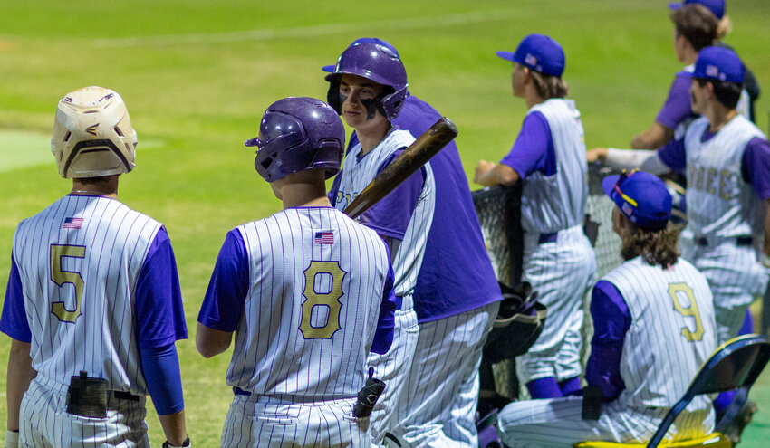 Carsen Williams and Ethan Blomefield talk in the Brahman dugout. [Photo by Richard Marion/Lake Okeechobee News]