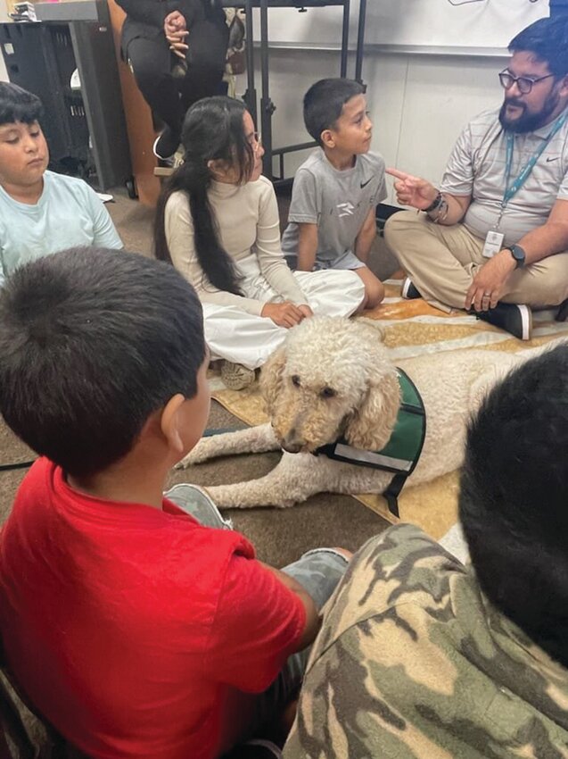 LABELLE -- Country Oaks Elementary School students enjoyed meeting therapy dogs on March 28. [Photo courtesy Country Oaks Elementary]