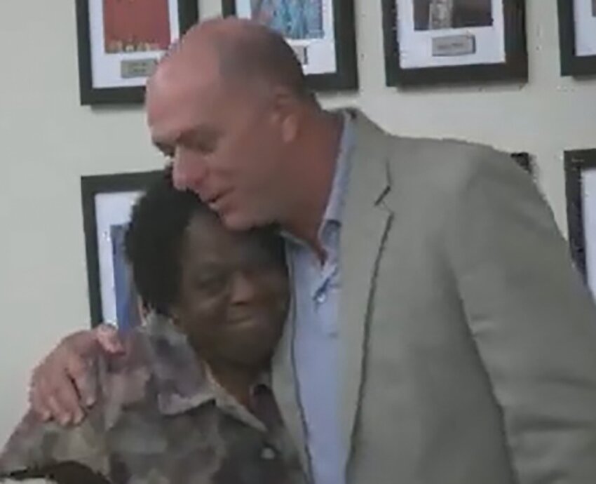 Lynvetta Myers hugs Superintendent of Schools Michael Swindle during the school board meeting April 3 where it was announced Myers would be retiring April 30. Myers was a school bus driver for 35 years at the school district. [Photo courtesy Hendry County School District]