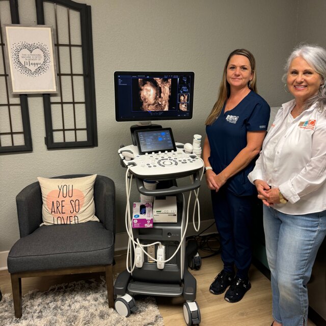 Ultrasound tech Michelle Anderson (left) and Robyn Garner assistant director are pictured with the Pregnancy Center of Okeechobee's new 4D ultrasound machine Maggie.