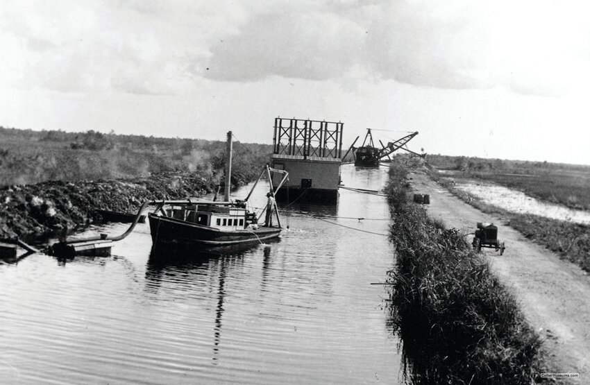 Dipper dredge, drill barge &amp; service boat 30 miles west of Miami, Tamiami Trail construction 1926-7. [Photo courtesy Collier Museums]