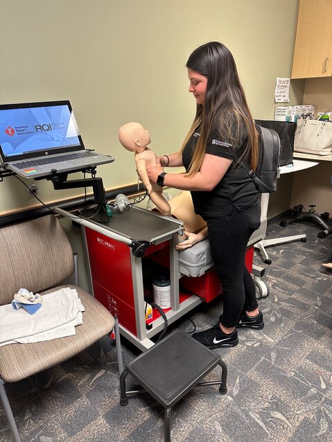 An Immokalee Foundation Healthcare Pathway student learns some of the tools of the trade