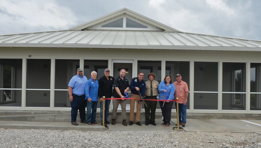 Audubon and Florida Park Service celebrated the opening of the new bunkhouse at Kissimmee Prairie Preserve State Park on May 15. The four-bedroom bunkhouse will be used by those conducting controlled burns, sparrow techs and AmeriCorps workers. [Photo by Katrina Elsken/Lake Okeechobee News]