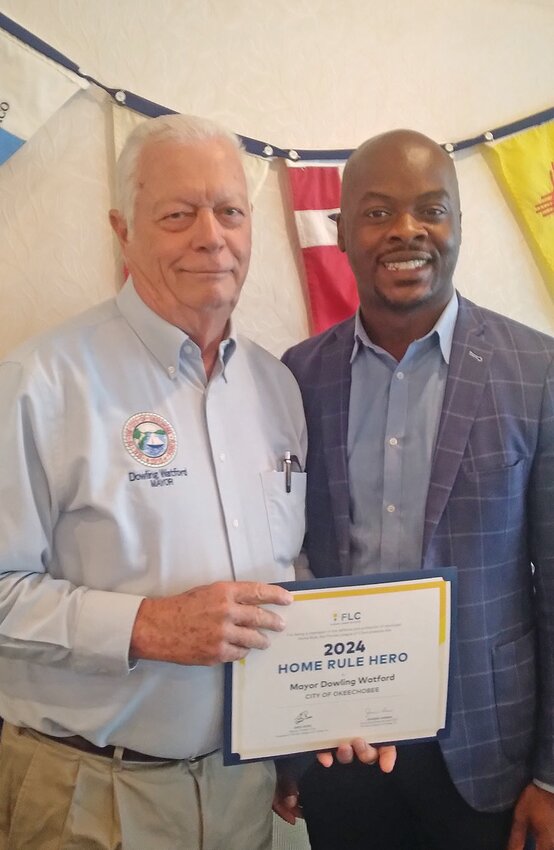 Jeff Branch, Florida League of Cities Sr. Legislative Advocate, presented the 2024 Home Rule Hero Award to Mayor Dowling Watford for his hard work and advocacy efforts during the 2024 Legislative Session. [Photo courtesy Florida League of Cities]