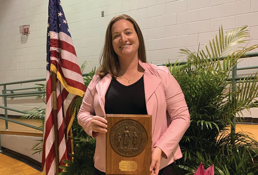 Christina Norman with her District Assitant Principal of the Year award in 2022. (Photo courtesy of Okeechobee Schools/Lake Okeechobee News)